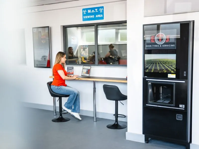 MOT testing customer waits in Eden Tyres waiting room